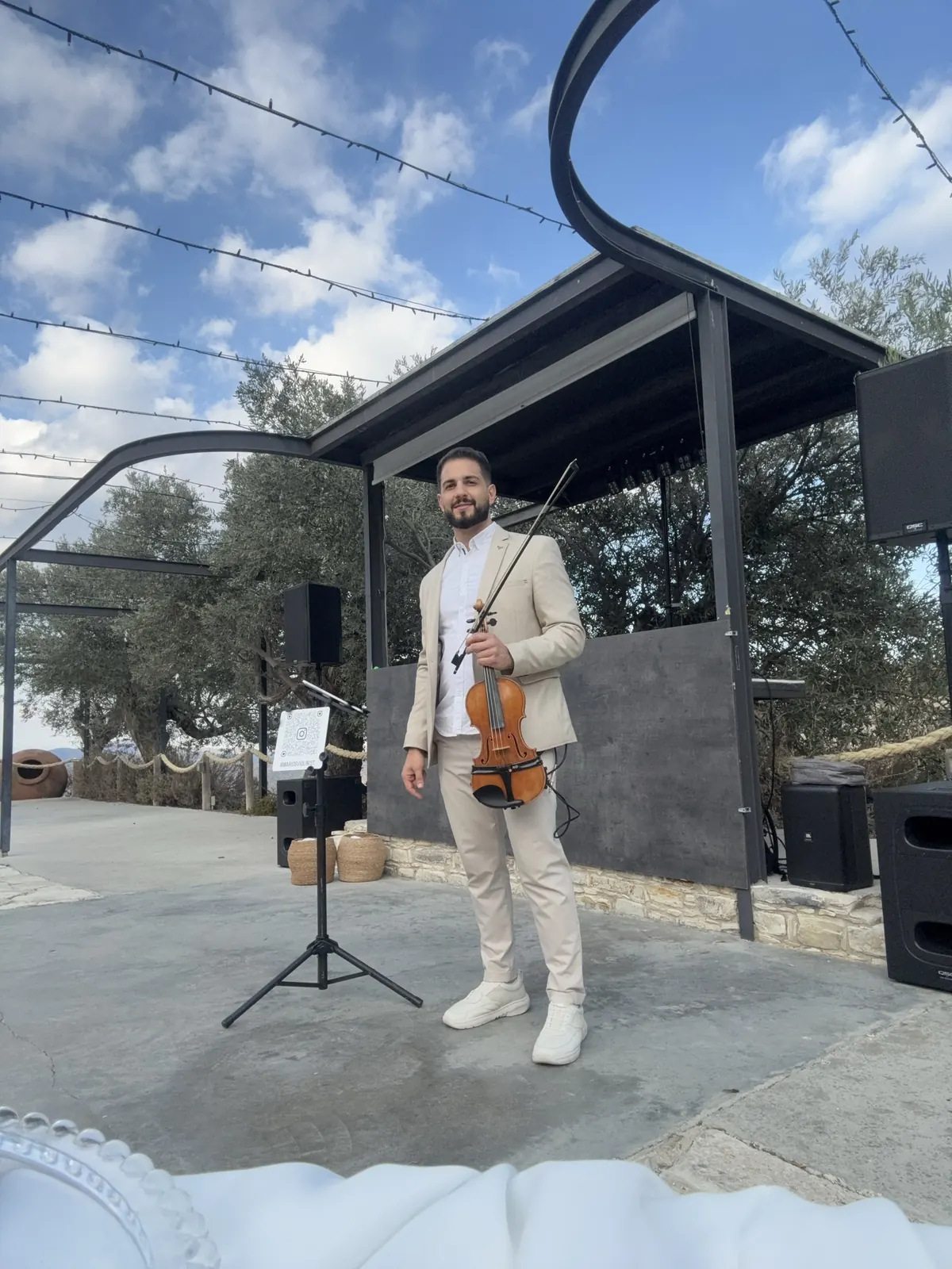 Portrait of Marios in sunglasses with his violin
